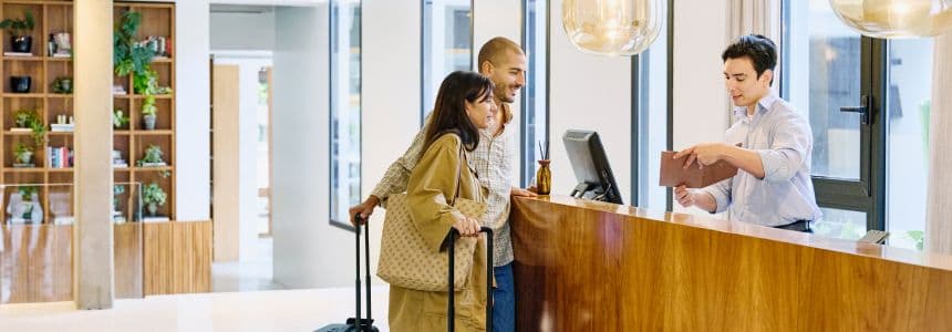 Couple at hotel check-in desk