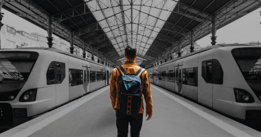 male walking in train station